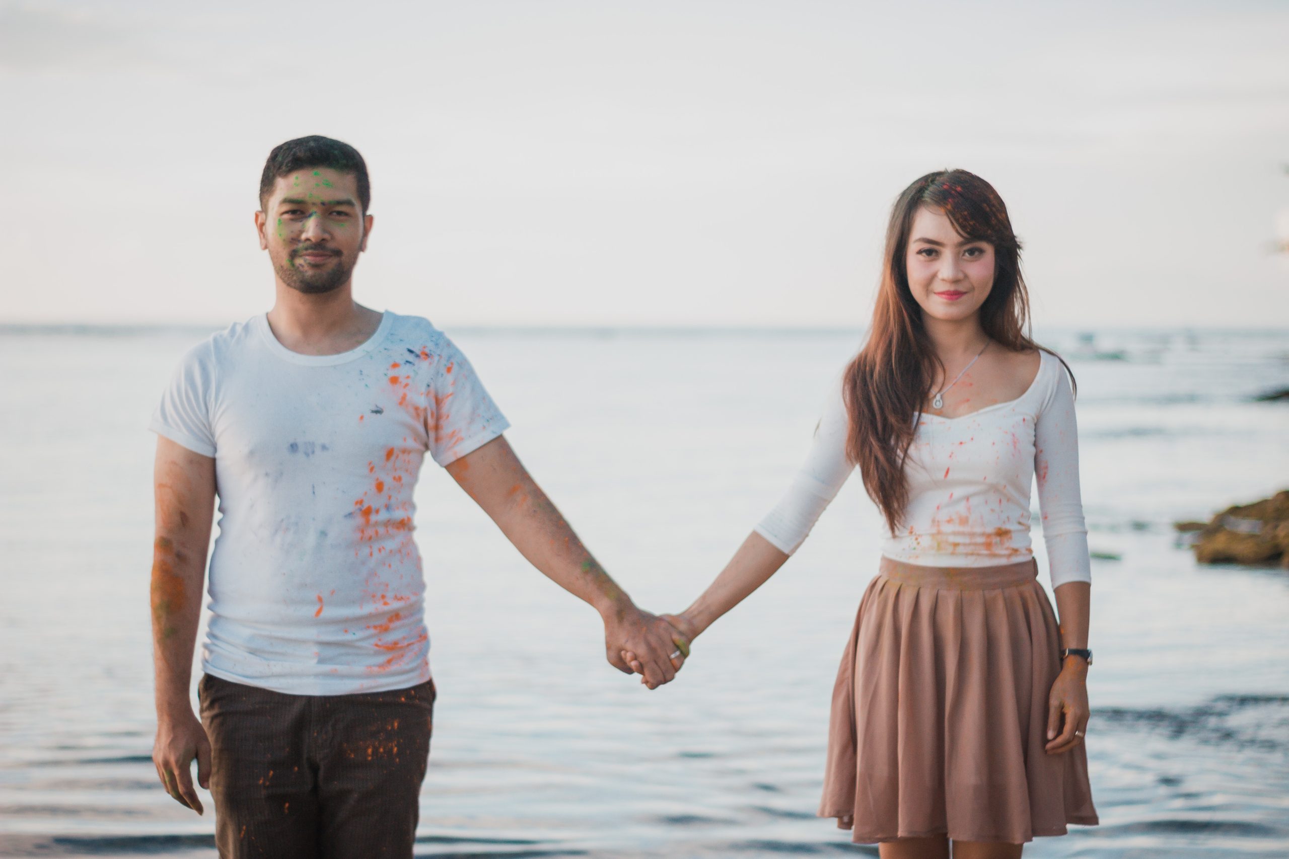 man and woman holding hands